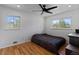 Bright bedroom with natural light, hardwood floors, and a ceiling fan at 4102 W Eastman Ave, Denver, CO 80236