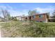 Beautiful brick home with a well-manicured lawn, offering great curb appeal at 4102 W Eastman Ave, Denver, CO 80236