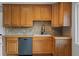 Well-maintained kitchen with wooden cabinets, modern fixtures, and durable countertops at 4102 W Eastman Ave, Denver, CO 80236