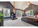 Relaxing bedroom with cozy gray walls, a TV, and a door to the outside at 16861 Wrangler Trl, Littleton, CO 80127