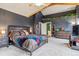 Tranquil bedroom featuring a large bed, decor and neutral tones for a relaxing atmosphere at 16861 Wrangler Trl, Littleton, CO 80127