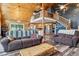 Open concept living area with fireplace, dining area, and staircase at 16861 Wrangler Trl, Littleton, CO 80127