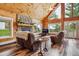 Comfortable living room featuring a stone fireplace and wood-look flooring at 16861 Wrangler Trl, Littleton, CO 80127