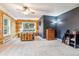 Comfortable main bedroom with wood accents, a ceiling fan, and natural light at 16861 Wrangler Trl, Littleton, CO 80127
