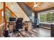 Well-lit office with wood accents, two workstations, and scenic views, perfect for remote work at 16861 Wrangler Trl, Littleton, CO 80127