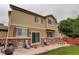 Two-story home featuring brick accents, sliding door and patio with outdoor seating at 15372 E 117Th Ave, Commerce City, CO 80022
