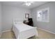 Serene bedroom featuring a single bed, window shutters, and a simple desk area for a comfortable space at 15372 E 117Th Ave, Commerce City, CO 80022