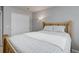 Cozy bedroom with a wood frame bed, soft patterned bedding, and ample natural light for a relaxing retreat at 15372 E 117Th Ave, Commerce City, CO 80022