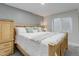 Comfortable bedroom features a cozy bed and natural light from a window at 15372 E 117Th Ave, Commerce City, CO 80022