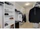 Organized walk-in closet with built-in shelving and hanging storage at 15372 E 117Th Ave, Commerce City, CO 80022