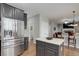 Spacious kitchen with stainless steel appliances, an island, and an open layout for easy entertaining and cooking at 15372 E 117Th Ave, Commerce City, CO 80022