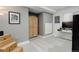 Finished basement area with stairs, closet, and television at 15372 E 117Th Ave, Commerce City, CO 80022