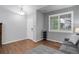 Living room with hardwood floors, and window shutters at 15372 E 117Th Ave, Commerce City, CO 80022