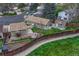Aerial shot highlighting the house, detached garage, patio, and fenced yard in a residential neighborhood at 9401 Otis St, Broomfield, CO 80021