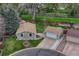 Aerial view of the property showcasing the house, garage, well-manicured yard and landscaping at 9401 Otis St, Broomfield, CO 80021