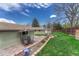 Serene backyard with lush lawn, patio area, and charming landscaping for outdoor enjoyment at 9401 Otis St, Broomfield, CO 80021
