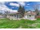 Inviting backyard with lush green grass and a shed at 9401 Otis St, Broomfield, CO 80021