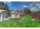 Large backyard featuring a shed and privacy fence at 9401 Otis St, Broomfield, CO 80021