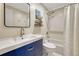 Bathroom features a modern vanity, mirror, and a shower-tub combination with white tiling at 9401 Otis St, Broomfield, CO 80021