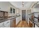Bright kitchen features stainless steel appliances, light cabinets, and a window with a view at 9401 Otis St, Broomfield, CO 80021