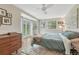 Comfortable main bedroom with hardwood floors, plenty of natural light, and a ceiling fan at 9401 Otis St, Broomfield, CO 80021
