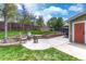 Large patio area with outdoor seating, brick accents, and well-maintained lawn at 9401 Otis St, Broomfield, CO 80021
