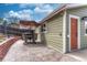 Cozy patio area featuring an outdoor dining set, shade umbrella, and convenient access to the house at 9401 Otis St, Broomfield, CO 80021