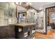 Stylish bathroom features a vanity with open shelving, modern fixtures, and a glass shower at 1792 Wynkoop St # 505, Denver, CO 80202