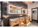 Modern bathroom featuring dual vanities, granite countertops and decorative mirrors at 1792 Wynkoop St # 505, Denver, CO 80202