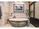 Stylish soaking tub with marble tiling and accent lighting create a relaxing atmosphere at 1792 Wynkoop St # 505, Denver, CO 80202