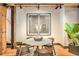 Stylish dining area with a round table, modern chairs, and decorative artwork at 1792 Wynkoop St # 505, Denver, CO 80202