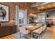 Spacious dining room features exposed brick, modern lighting, and seating for eight at 1792 Wynkoop St # 505, Denver, CO 80202
