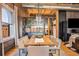 Open-concept dining room features exposed brick, modern lighting, and seating for eight at 1792 Wynkoop St # 505, Denver, CO 80202