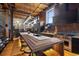 Stylish kitchen with bar seating, stainless steel appliances, wood floors, exposed brick, and modern lighting at 1792 Wynkoop St # 505, Denver, CO 80202