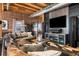 Comfortable living room with a large sectional sofa, media center, and exposed brick walls at 1792 Wynkoop St # 505, Denver, CO 80202