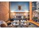 Inviting living room with exposed brick, modern decor, and comfortable seating arrangement at 1792 Wynkoop St # 505, Denver, CO 80202
