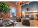 Spacious loft living room featuring exposed brick, high ceilings, and modern furnishings at 1792 Wynkoop St # 505, Denver, CO 80202
