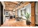 Bright living room with hardwood floors, exposed beams, and a dining area at 1792 Wynkoop St # 505, Denver, CO 80202