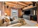 Comfortable main bedroom features exposed brick, wood beams, and modern decor at 1792 Wynkoop St # 505, Denver, CO 80202