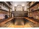 Walk-in pantry with custom wood cabinetry, open shelving, and brick accent walls at 1792 Wynkoop St # 505, Denver, CO 80202