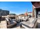 Luxurious rooftop deck featuring comfortable lounge seating and panoramic city views at 1792 Wynkoop St # 505, Denver, CO 80202