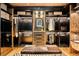 Beautiful walk-in closet with custom shelving, wooden floors and soft accent lighting at 1792 Wynkoop St # 505, Denver, CO 80202