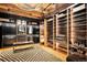 Large walk-in closet with custom shelving, lighting, and ample storage space at 1792 Wynkoop St # 505, Denver, CO 80202