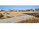 A community park surrounded by modern homes, featuring green spaces and walking paths at 6334 N Dayton Way, Denver, CO 80238