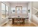 Chic dining room with a modern table, stylish chairs, and a contemporary light fixture at 6334 N Dayton Way, Denver, CO 80238