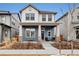 Charming two-story home with a welcoming front porch, stone accents, and manicured landscaping at 6334 N Dayton Way, Denver, CO 80238