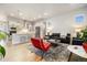 Open concept living space featuring a modern kitchen and a comfortable living area at 6334 N Dayton Way, Denver, CO 80238