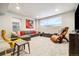Cozy living room features a large sectional, leather chair, and projector screen at 6334 N Dayton Way, Denver, CO 80238