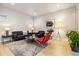 Cozy living room with modern furnishings, decorative rug, and contemporary art at 6334 N Dayton Way, Denver, CO 80238