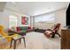 Spacious living room with a large sectional, leather chair, and projector screen at 6334 N Dayton Way, Denver, CO 80238